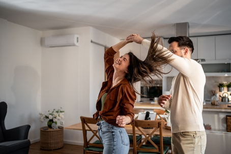 Couple enjoying the comfort of their AC.